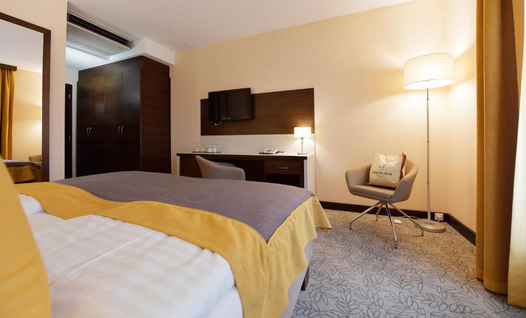 Postel nebo postele na pokoji v ubytování Seehotel Rust