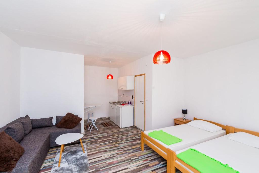 Posteľ alebo postele v izbe v ubytovaní Apartments Sany
