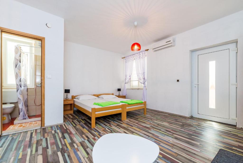 Posteľ alebo postele v izbe v ubytovaní Apartments Sany