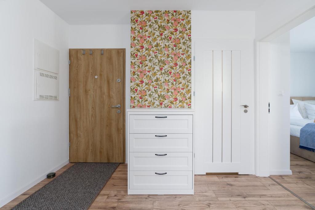 Posteľ alebo postele v izbe v ubytovaní Rezydencja Rejtana with FREE GARAGE Poznań by Noclegi Renters