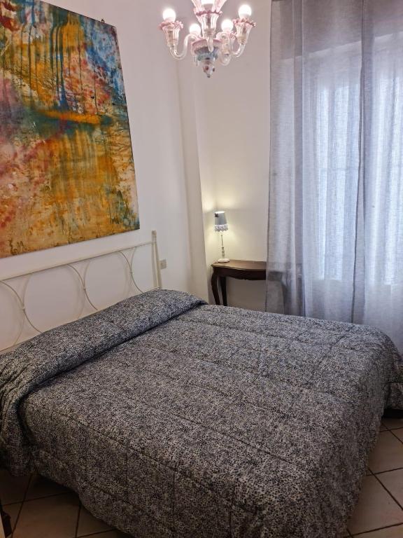 Łóżko lub łóżka w pokoju w obiekcie Maia Incantevole