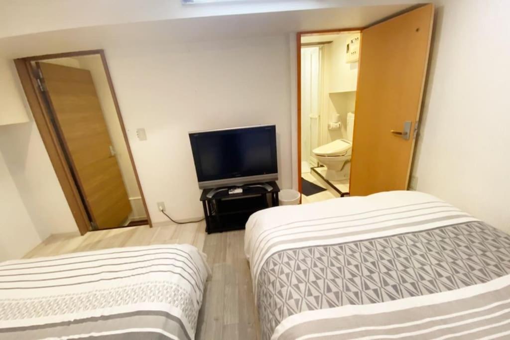 Postel nebo postele na pokoji v ubytování Takemura Building 104