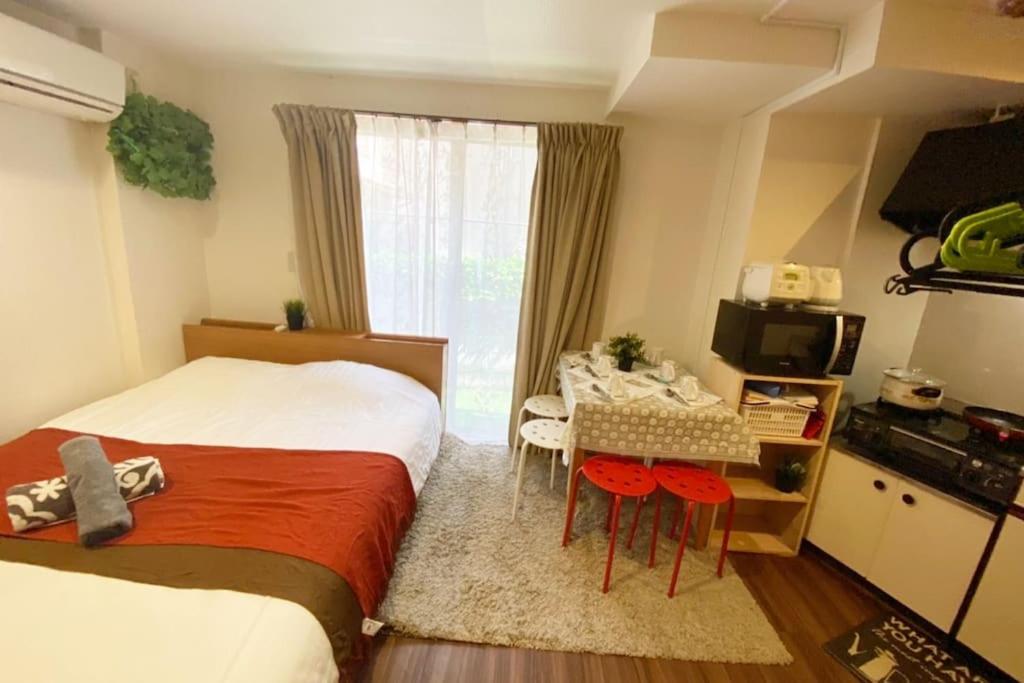 Postel nebo postele na pokoji v ubytování Takemura Building 104