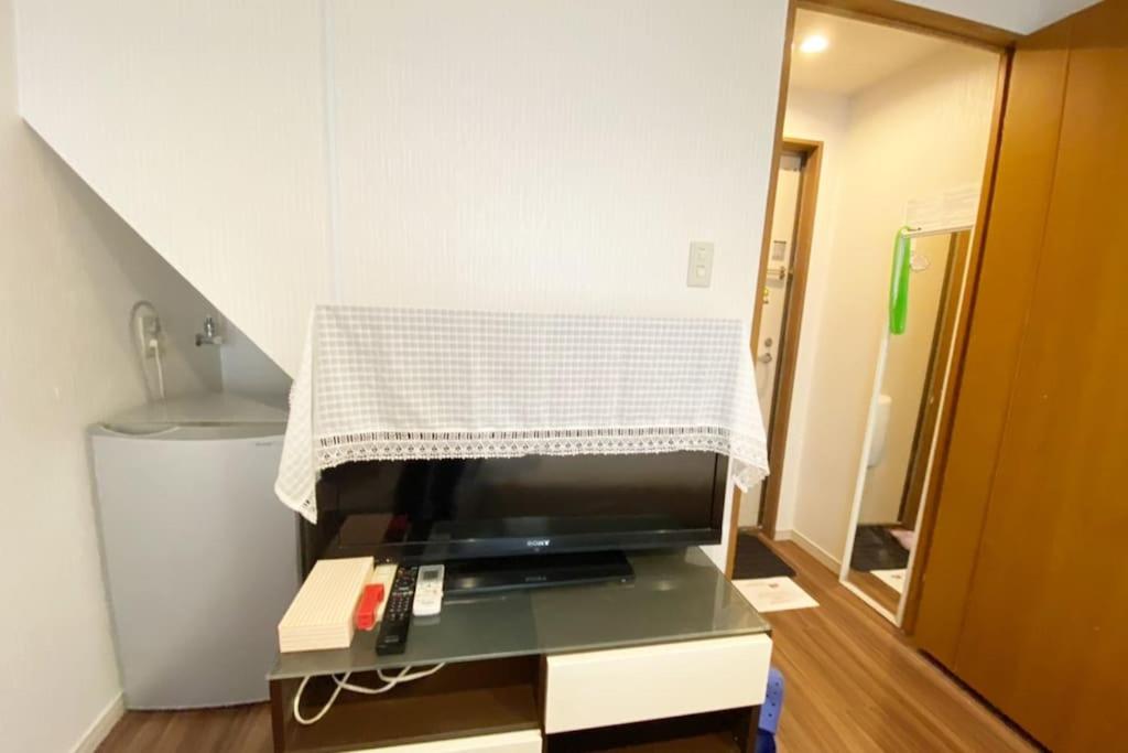 TV a/nebo společenská místnost v ubytování Takemura Building 104