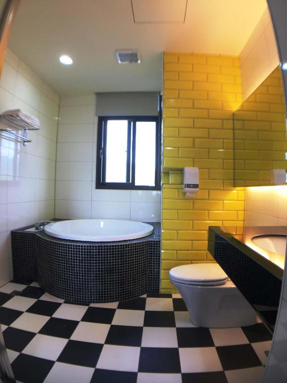 Postel nebo postele na pokoji v ubytování CoCo Motel Boutique