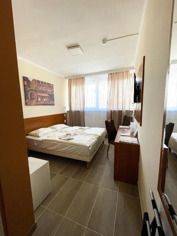 Posteľ alebo postele v izbe v ubytovaní Öreg-tó Hotel és Rendezvénytér