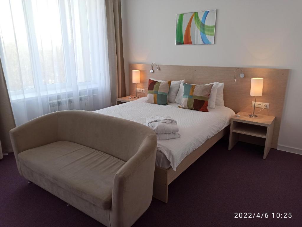 Een bed of bedden in een kamer bij Loft Hotel