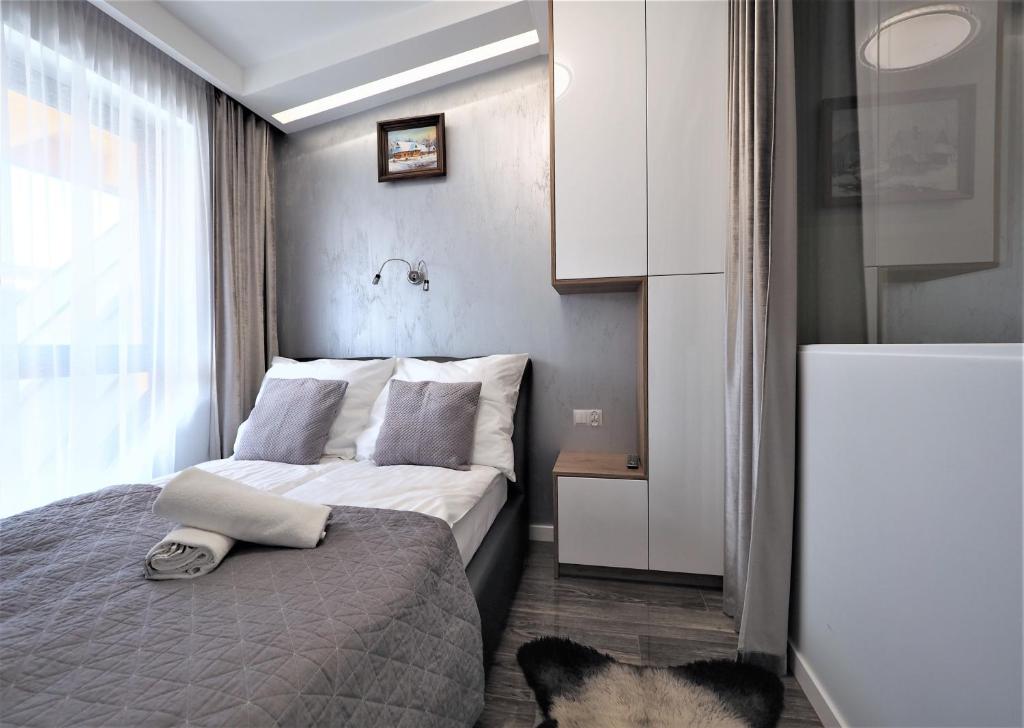 Posteľ alebo postele v izbe v ubytovaní VIP Apartamenty Modrzejewska Residence