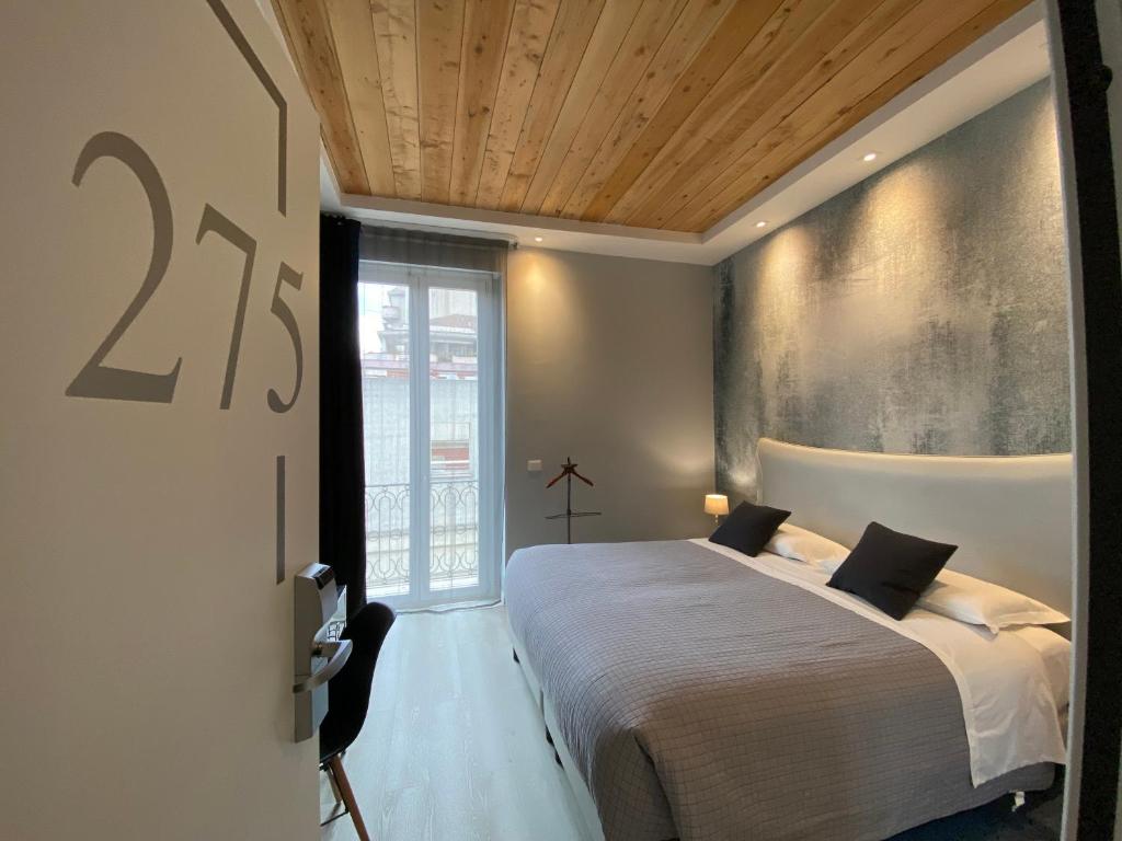 Postel nebo postele na pokoji v ubytování Residenze Romano Ristorante & SPA albergo diffuso - WHITE