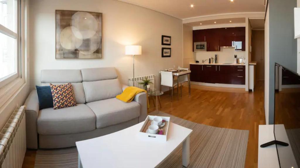 a living room with a couch and a table at Urzaiz Centro Vigo in Vigo