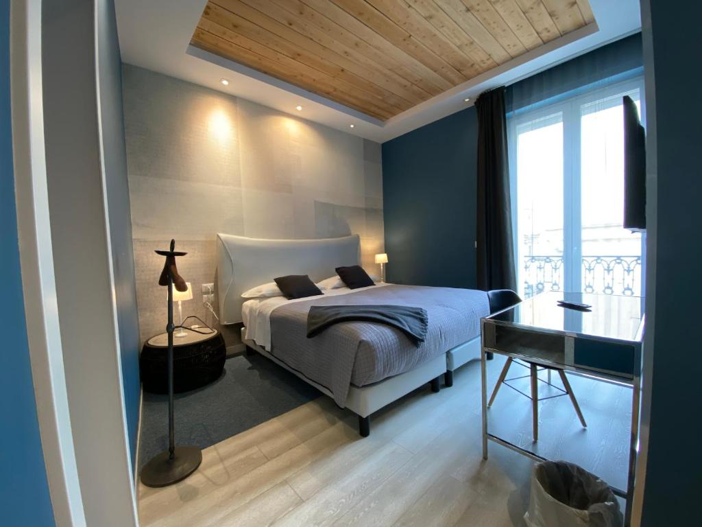 Postel nebo postele na pokoji v ubytování Residenze Romano Ristorante & SPA albergo diffuso - WHITE