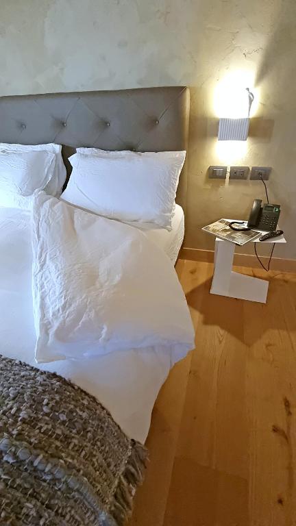 Postel nebo postele na pokoji v ubytování Corte degli OstiNati