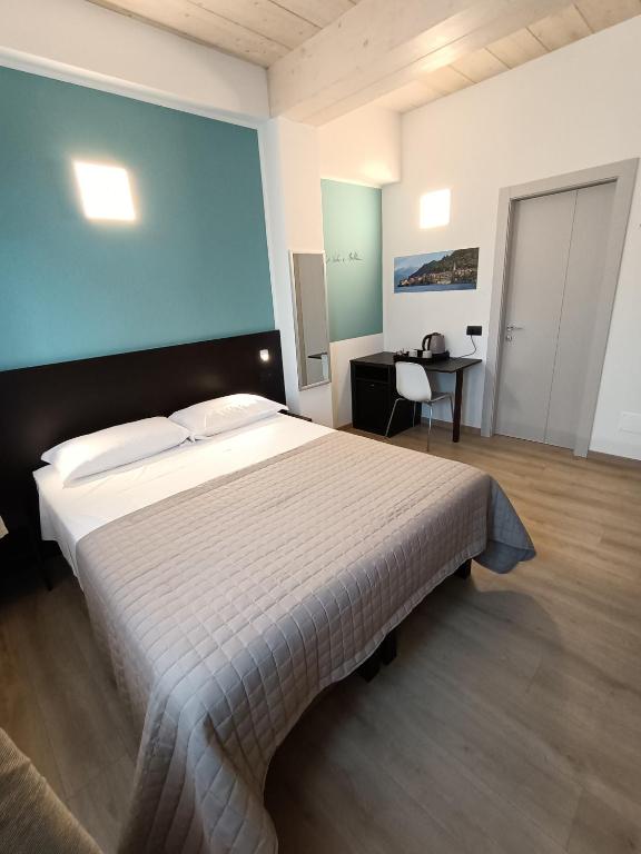 Postel nebo postele na pokoji v ubytování Il B&B di PIAZZA MOTTA