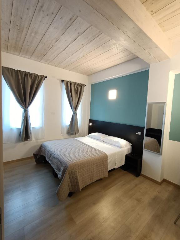 Postel nebo postele na pokoji v ubytování Il B&B di PIAZZA MOTTA