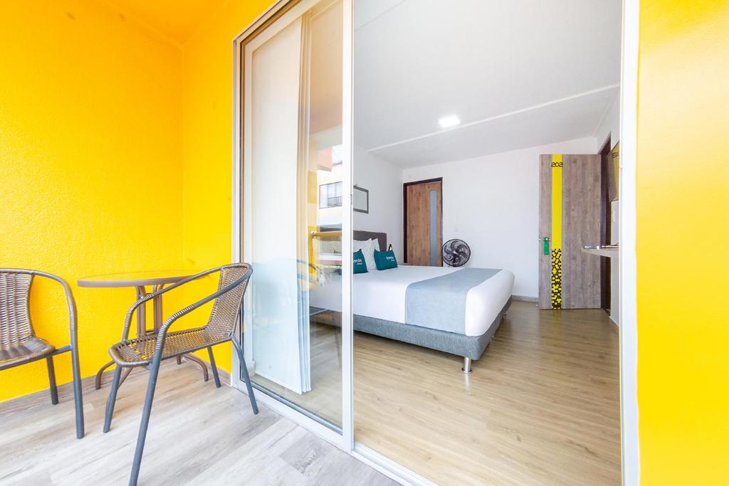 Postel nebo postele na pokoji v ubytování Ayenda Bee Hotel