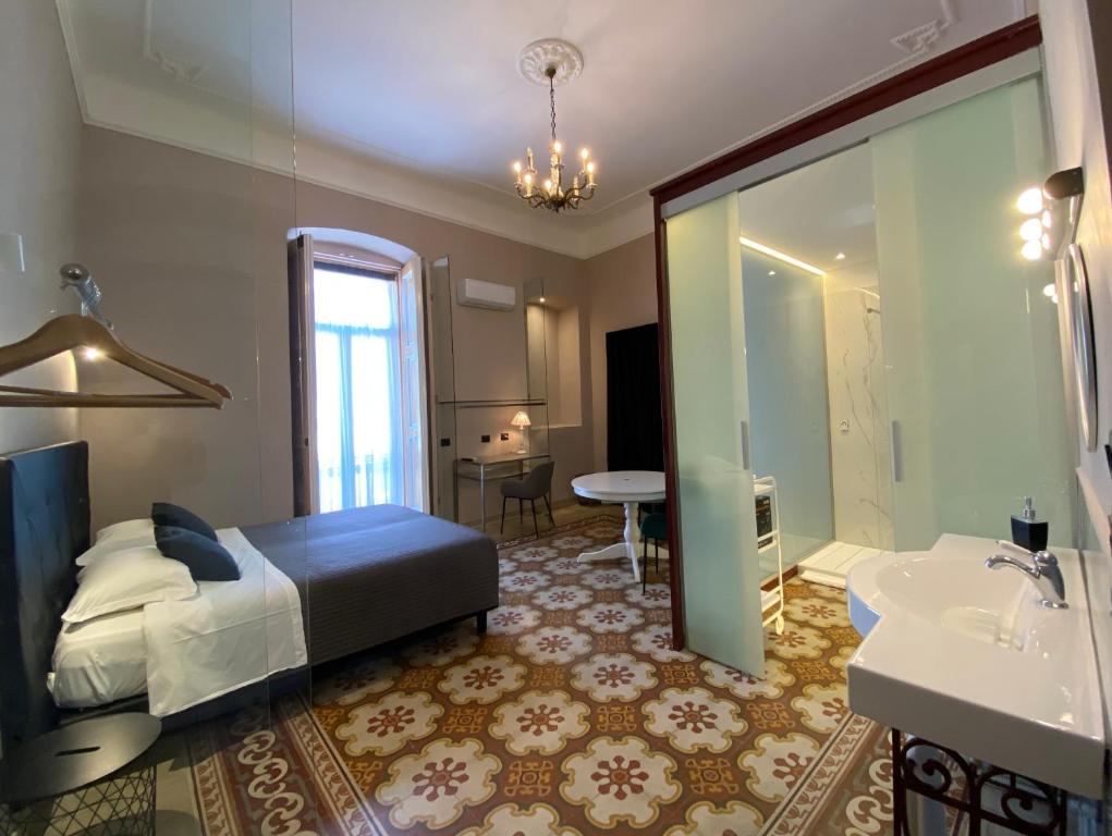 Postel nebo postele na pokoji v ubytování Residenze Romano Ristorante & Spa - albergo diffuso - RED
