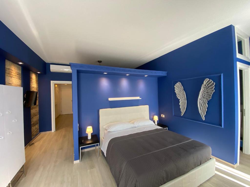 Postel nebo postele na pokoji v ubytování Residenze Romano Ristorante & Spa - albergo diffuso - RED