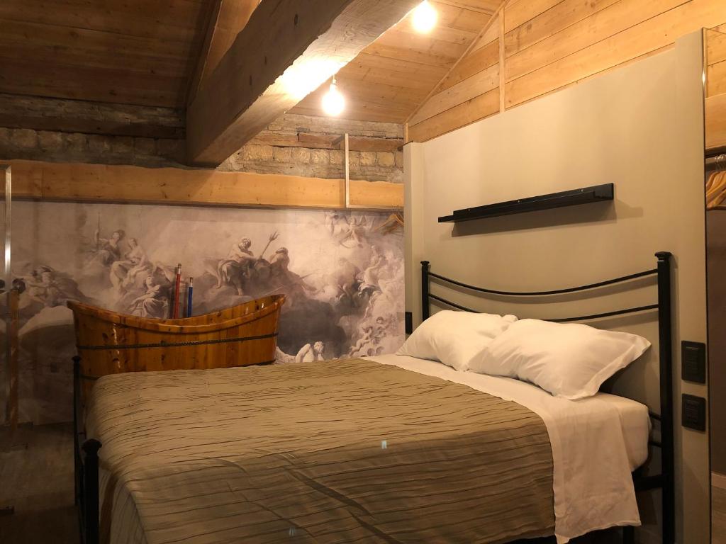 Postel nebo postele na pokoji v ubytování Residenze Romano Ristorante & Spa - albergo diffuso - RED
