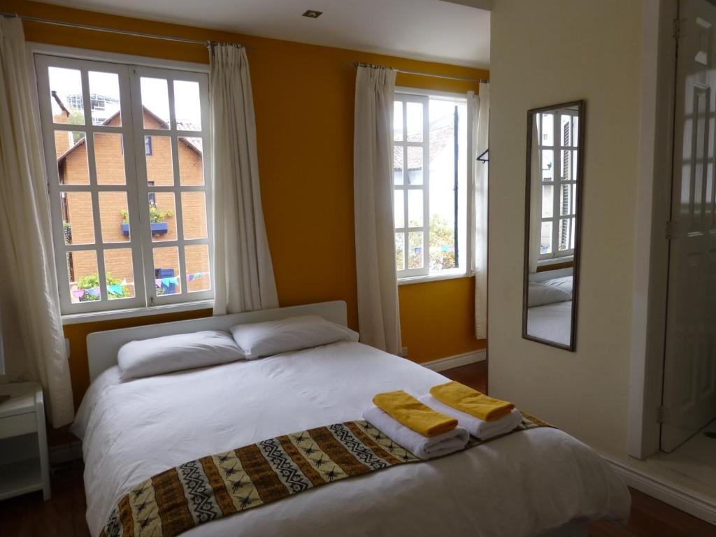 Postel nebo postele na pokoji v ubytování Hotel Cayman