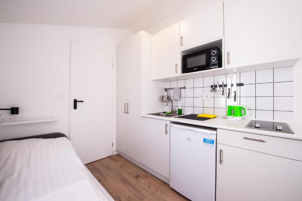 Kuchyňa alebo kuchynka v ubytovaní Chesscom Apartments