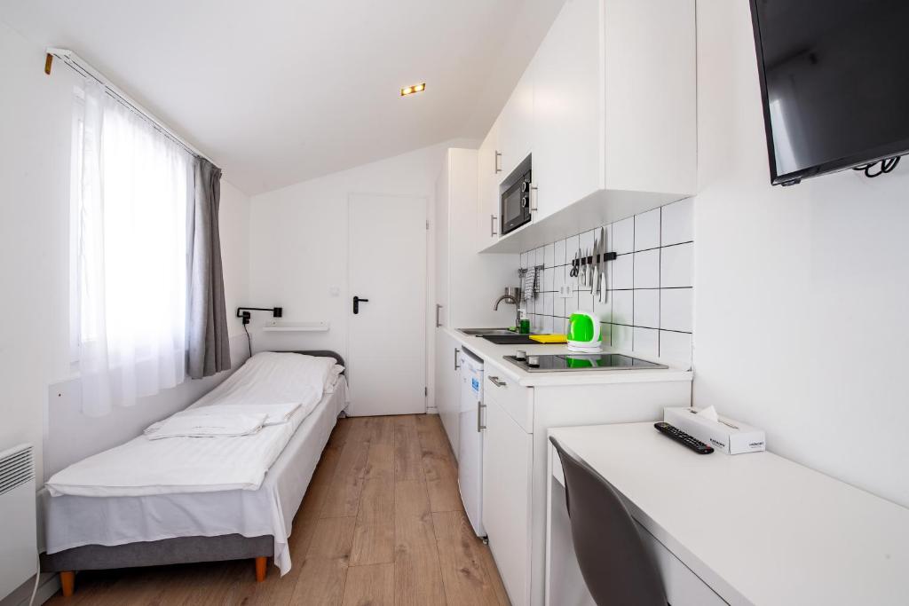Posteľ alebo postele v izbe v ubytovaní Chesscom Apartments