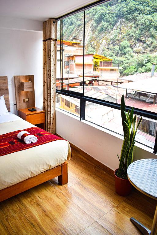 Postel nebo postele na pokoji v ubytování Runas Inn Machupicchu