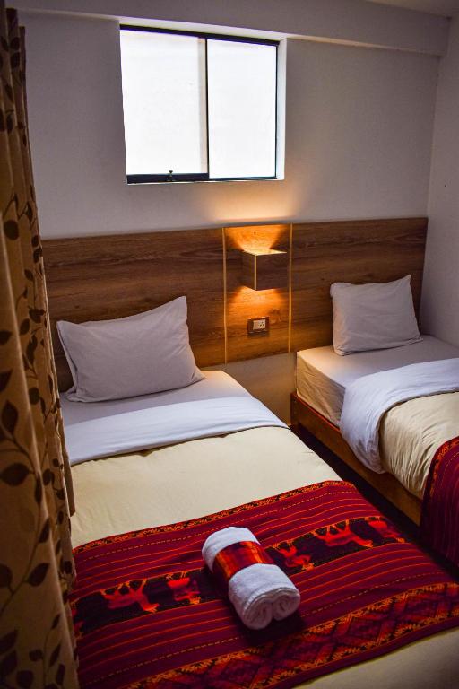 Postel nebo postele na pokoji v ubytování Runas Inn Machupicchu