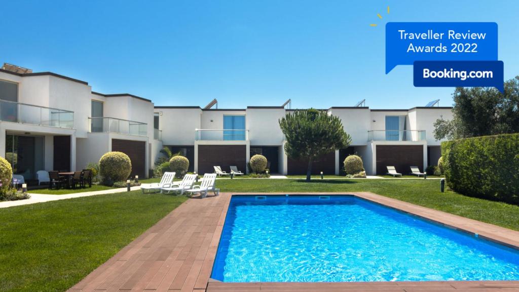 a villa with a swimming pool in a resort at Sagres Blue Villa H - 10 min walk to the beach in Sagres