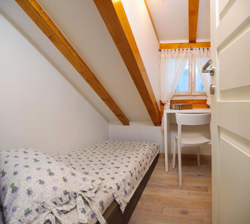 Postel nebo postele na pokoji v ubytování Apartment Atticus