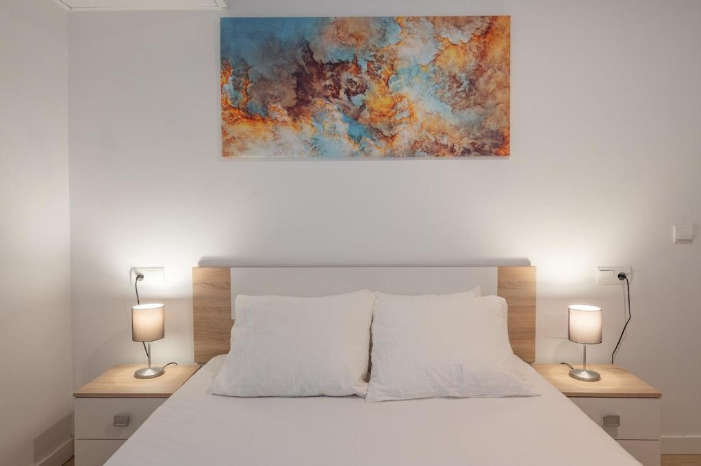 Łóżko lub łóżka w pokoju w obiekcie Suite Homes Parras duplex