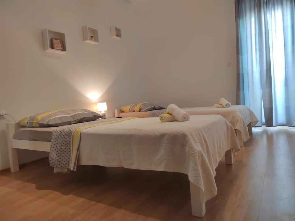 Postel nebo postele na pokoji v ubytování Apartman Memories