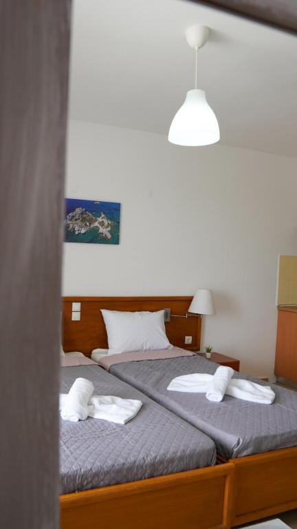 Postel nebo postele na pokoji v ubytování Pittas Studios