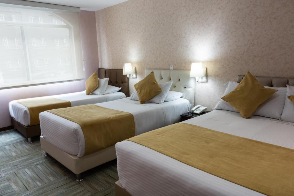 Postel nebo postele na pokoji v ubytování Hotel Risot