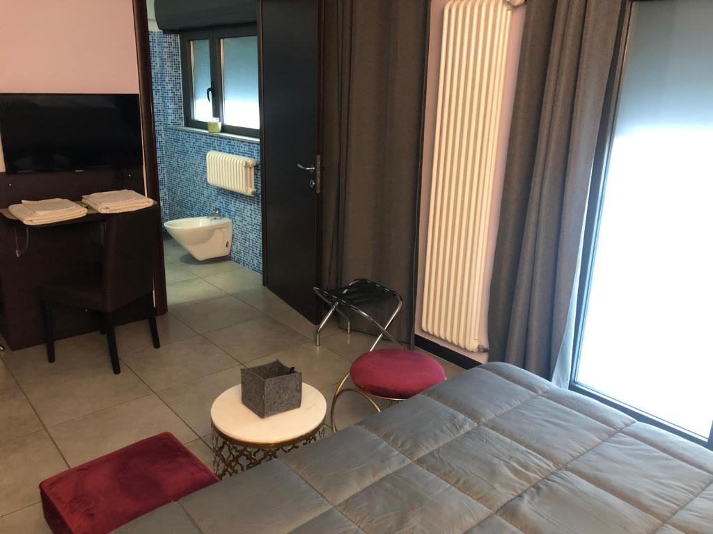 Posteľ alebo postele v izbe v ubytovaní Villa Camilla Milano