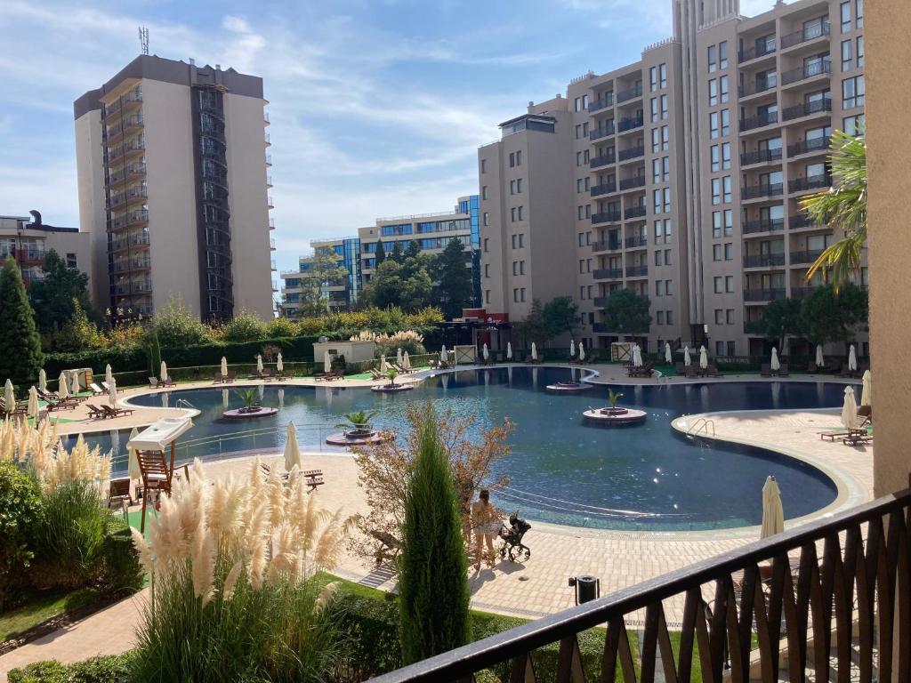 a view of a pool in a city with buildings at Barcelo Royal Beach Private Apartment in Sunny Beach