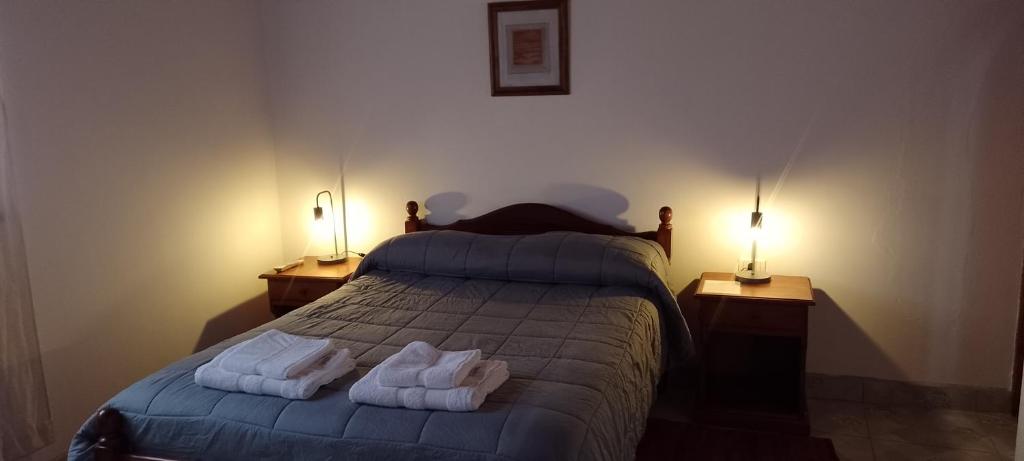 La Colorada Hostal tesisinde bir odada yatak veya yataklar