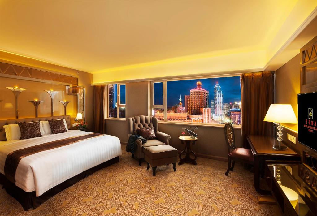 Postel nebo postele na pokoji v ubytování Hotel Beverly Plaza