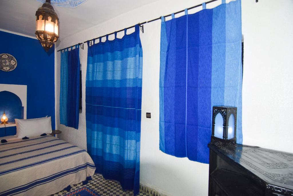 Postel nebo postele na pokoji v ubytování Riad Vis Ta Vie