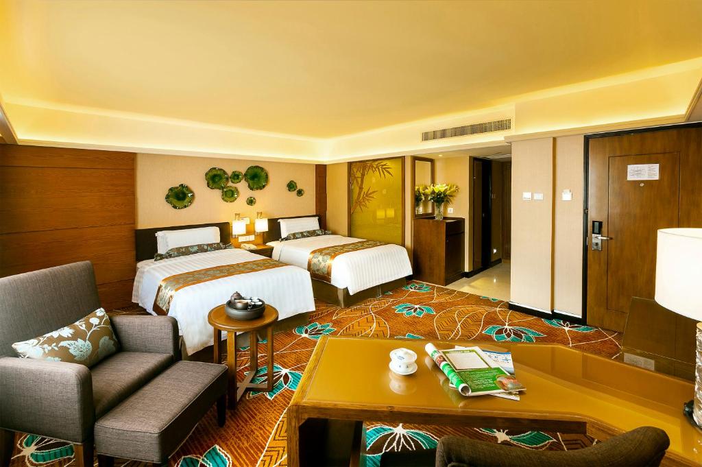 Postel nebo postele na pokoji v ubytování Hotel Beverly Plaza