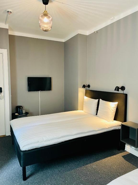 Postel nebo postele na pokoji v ubytování Birka Hotel