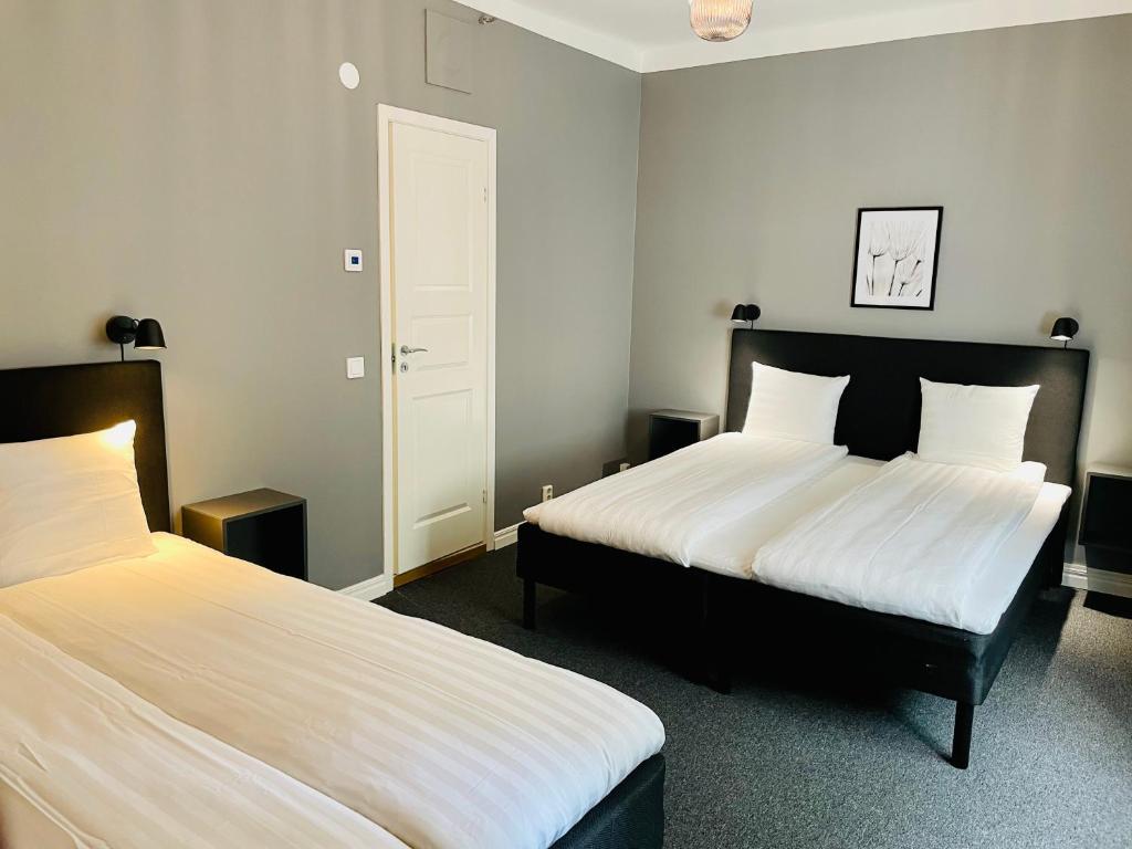 Postel nebo postele na pokoji v ubytování Birka Hotel