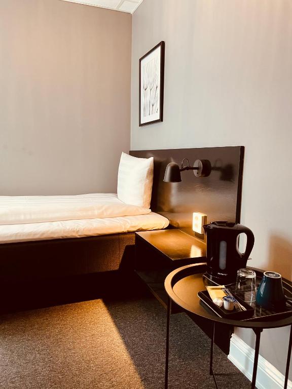 Postel nebo postele na pokoji v ubytování Birka Hotel