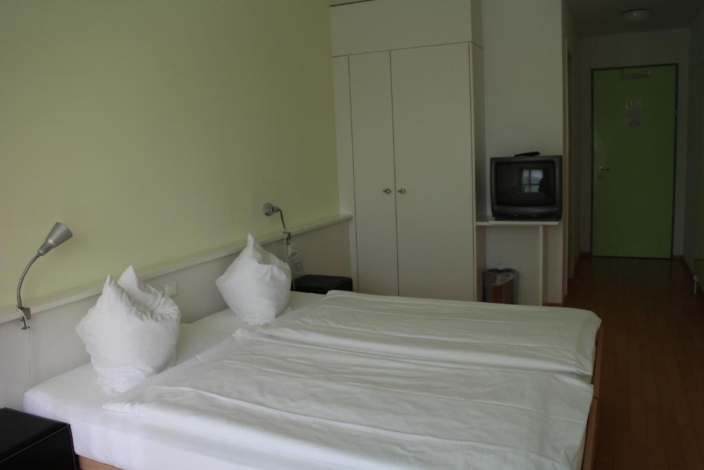 Voodi või voodid majutusasutuse Seminar-Hotel Rigi am See toas