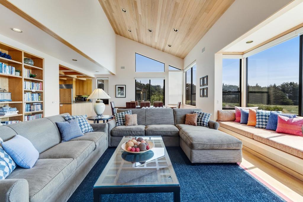 a living room with a couch and a table at The Indigo in Sea Ranch
