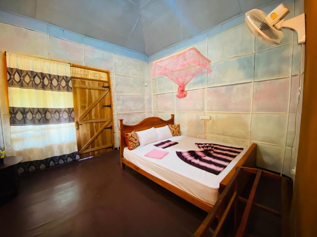 Postel nebo postele na pokoji v ubytování Sigiri Lion Eco Palace