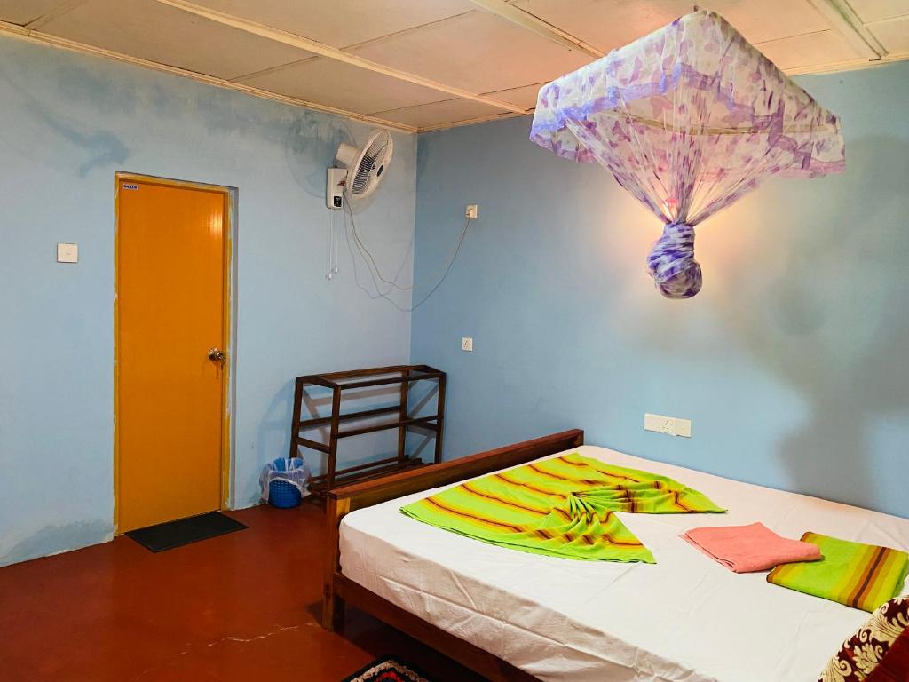 Postel nebo postele na pokoji v ubytování Sigiri Lion Eco Palace