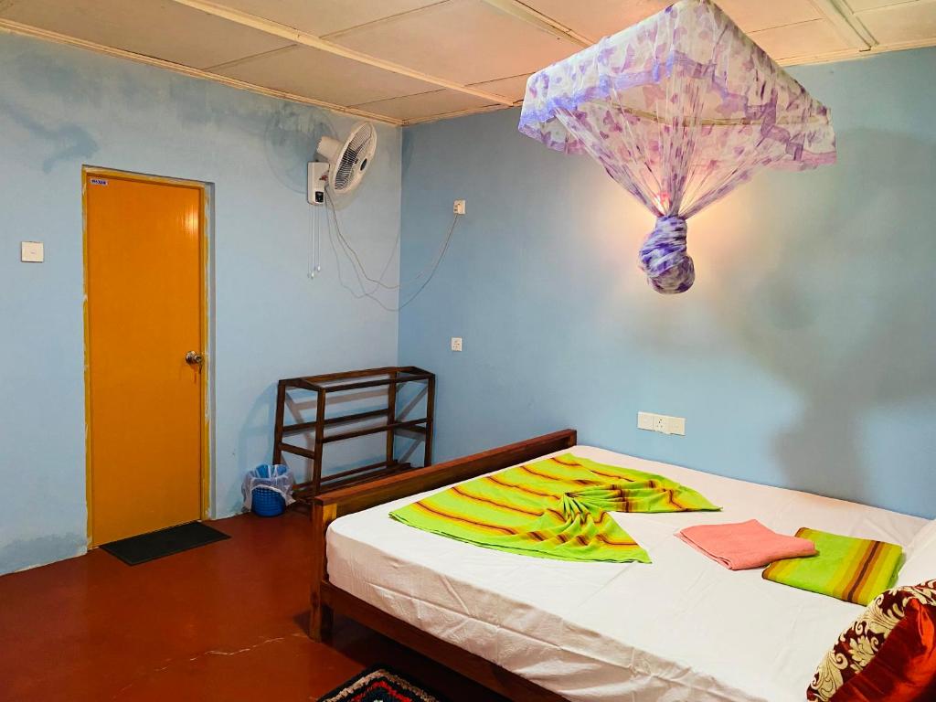 Postel nebo postele na pokoji v ubytování Sigiri Lion Eco Palace
