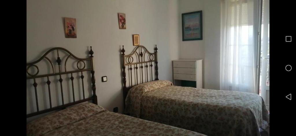 Łóżko lub łóżka w pokoju w obiekcie Somonte Costa