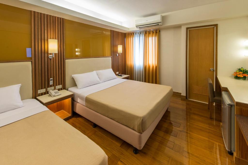 Kabayan Hotel Pasayにあるベッド