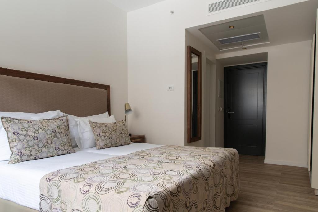 Postel nebo postele na pokoji v ubytování Montefiore Hotel By Smart Hotels